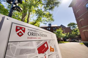 A "Harvard College Orientation" sign placed in Harvard Yard on first-year move-in day.