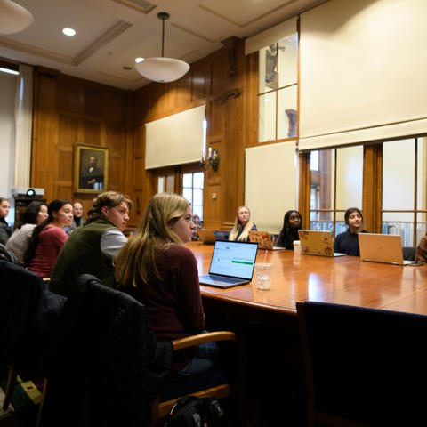 Students seated around a round table
