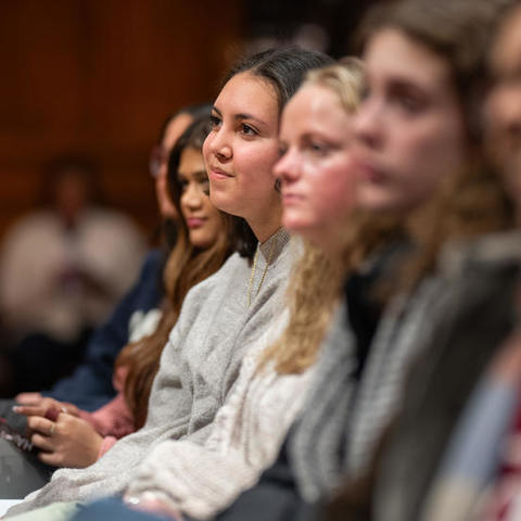 Students listen intently during a program.
