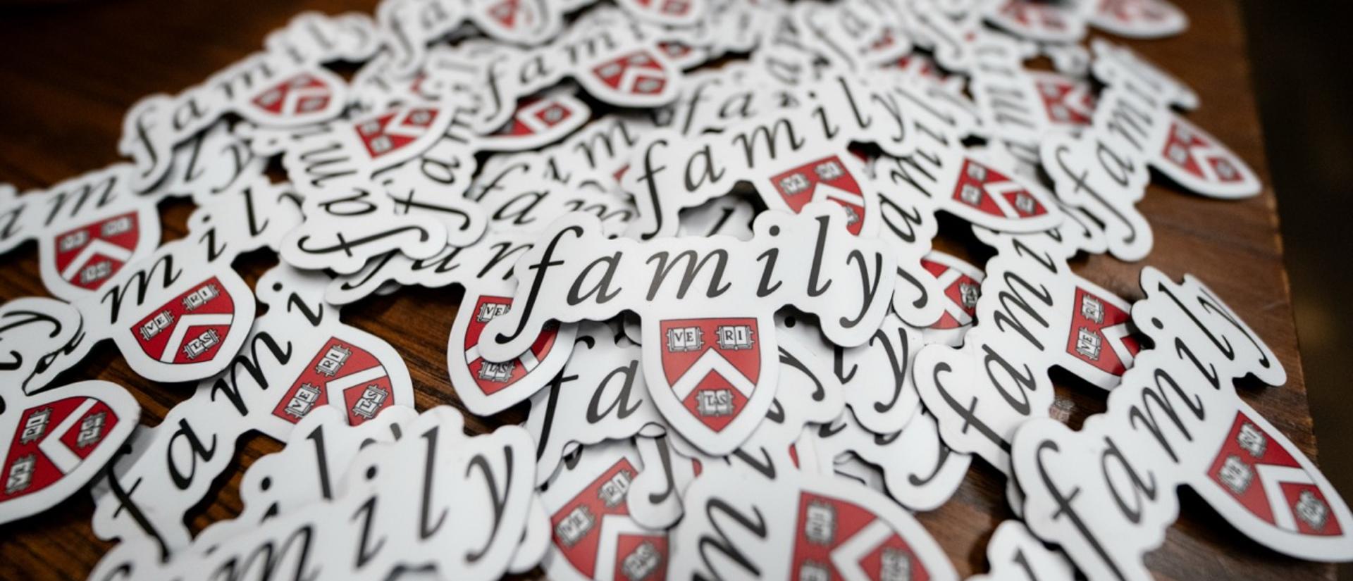 Harvard College families decal stickers spread out on top of the table.