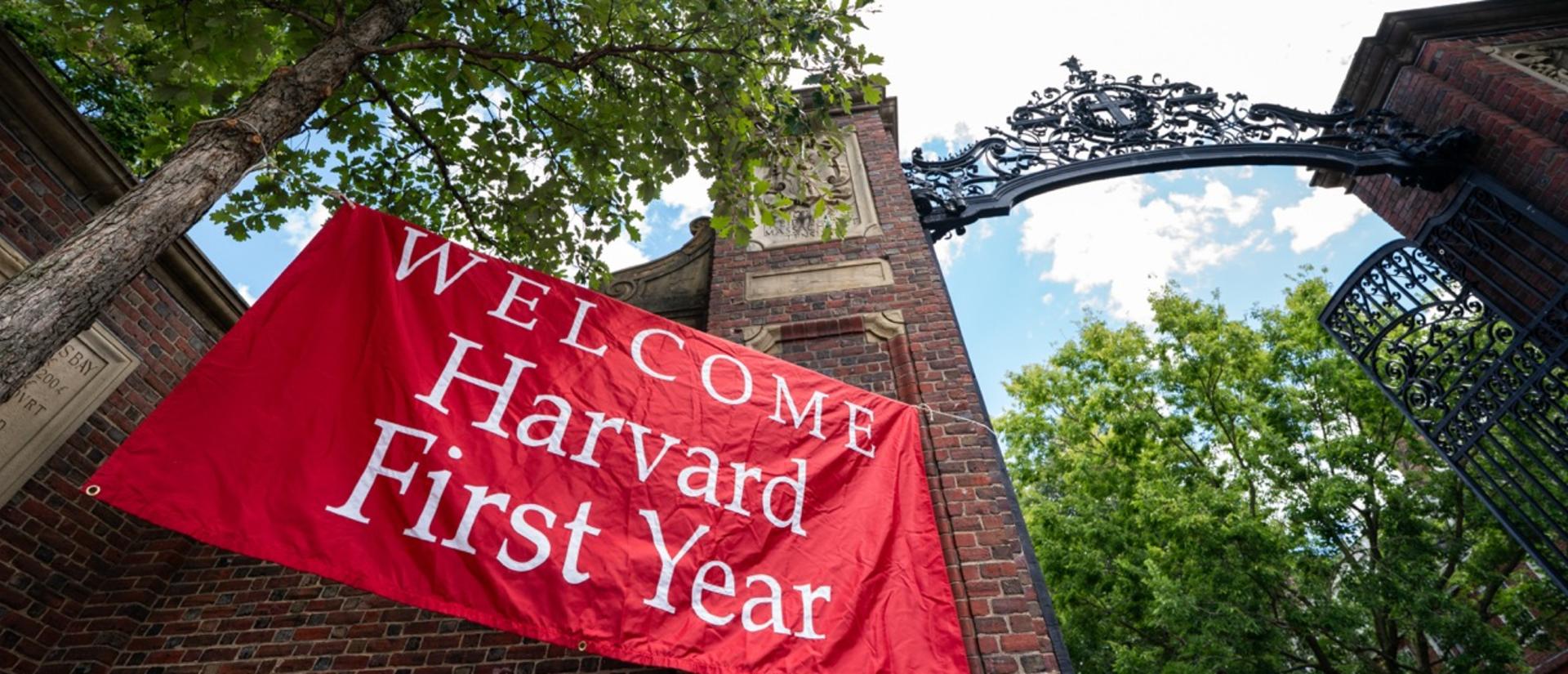 A "Welcome Harvard First-Year" banner outside of Johnston Gate on move-in day.